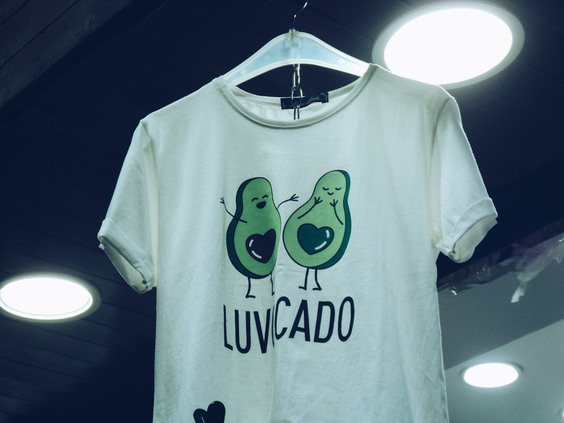 White t-shirt with avocado graphic and text