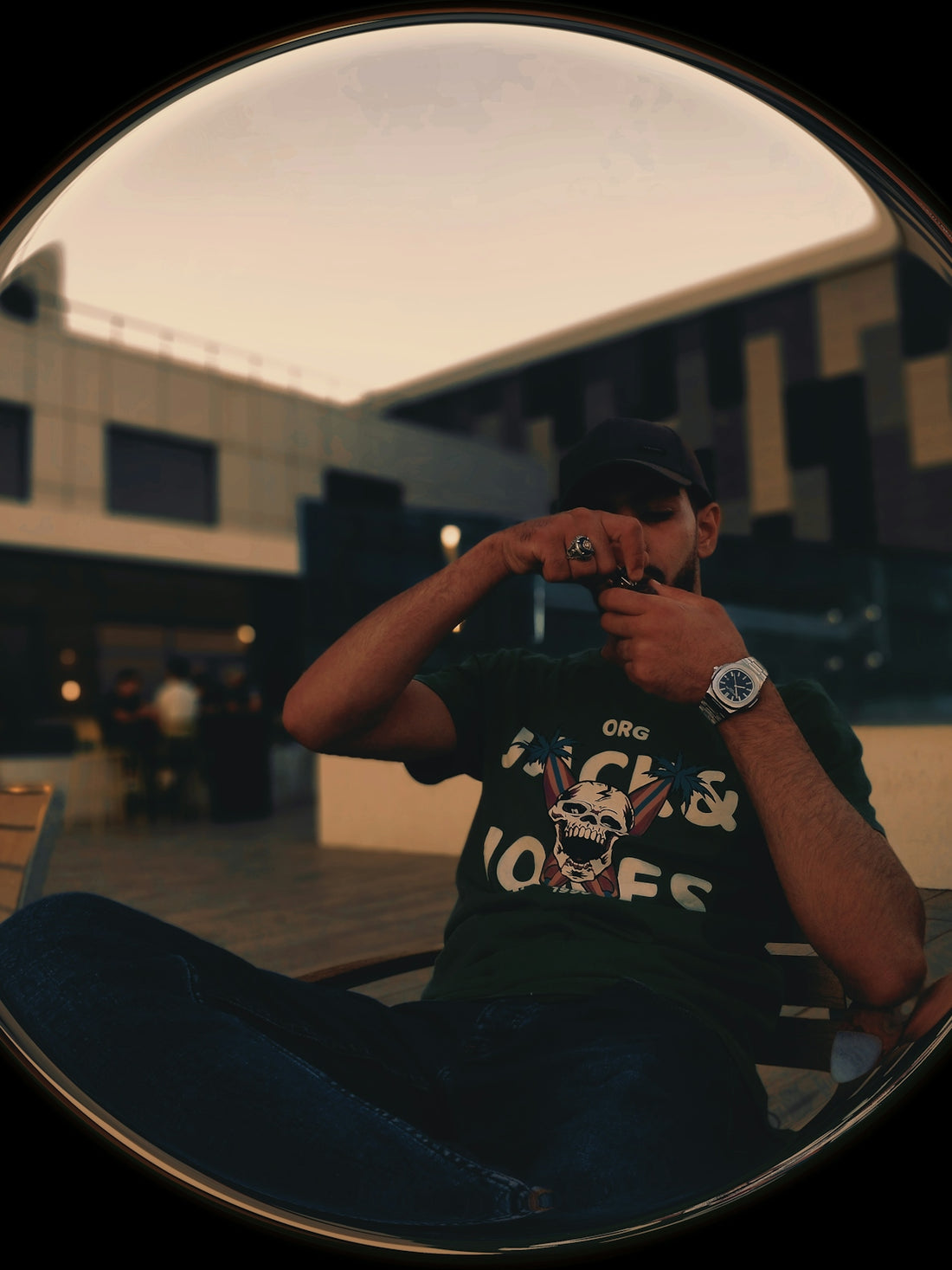 Man in a dark t-shirt taking a picture