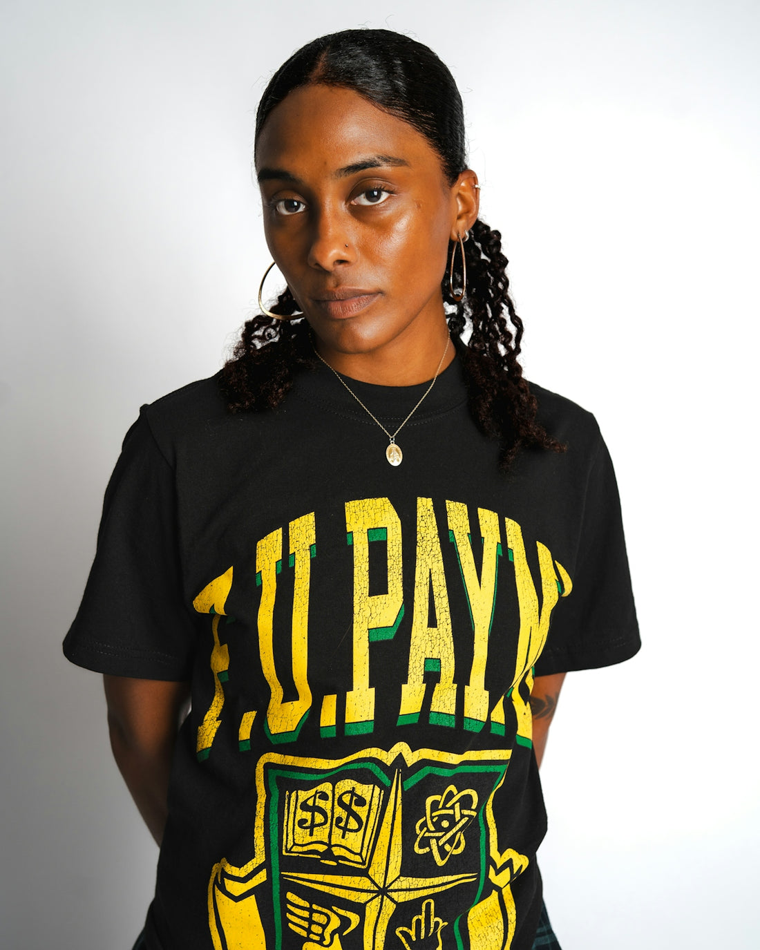 A young black woman wearing a black t-shirt.