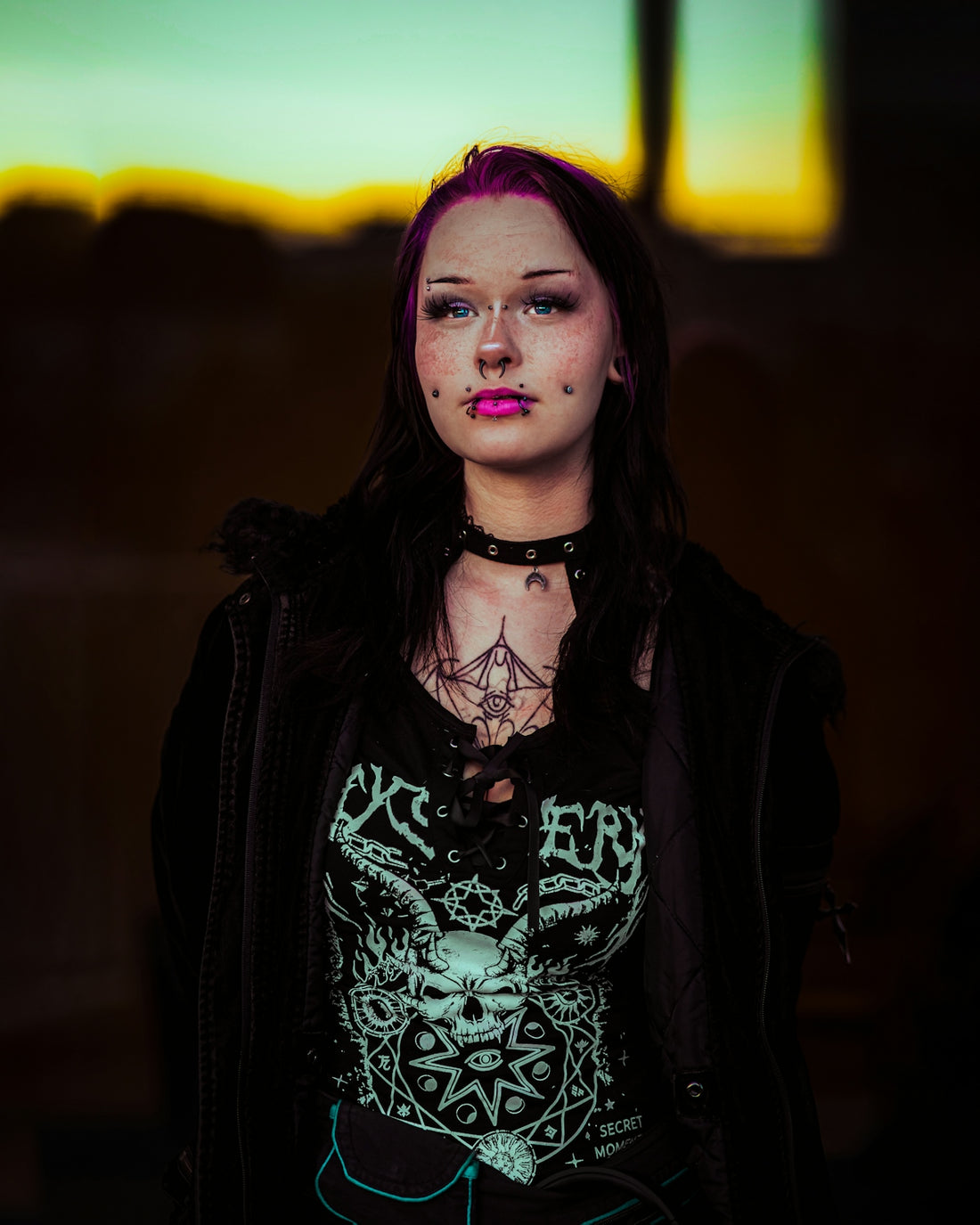 Young woman with pink hair and piercings