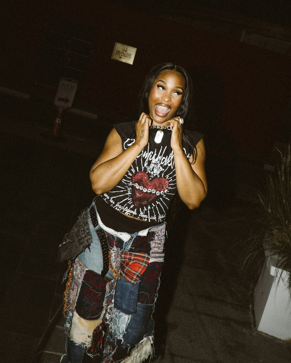 Woman in graphic t-shirt and patchwork pants