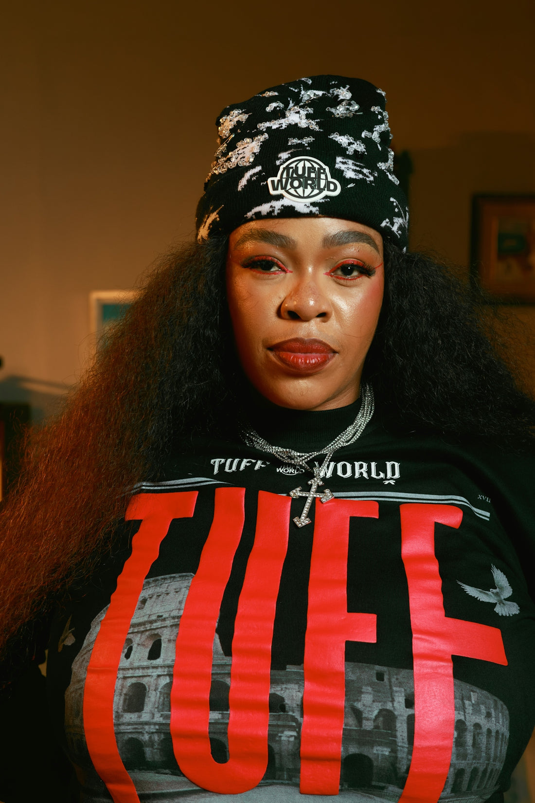 Woman wearing a beanie and graphic t-shirt
