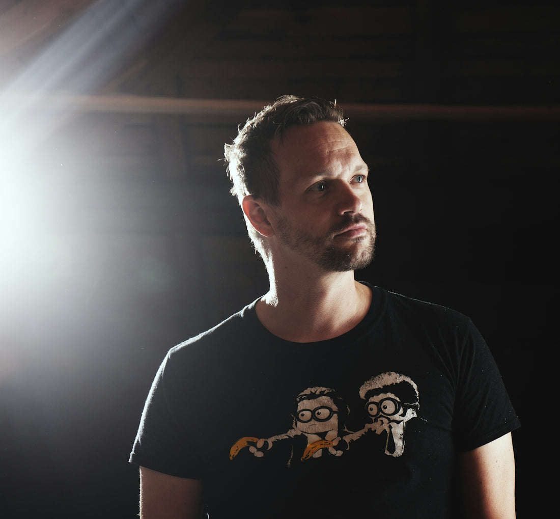 Man with beard wearing a graphic t-shirt