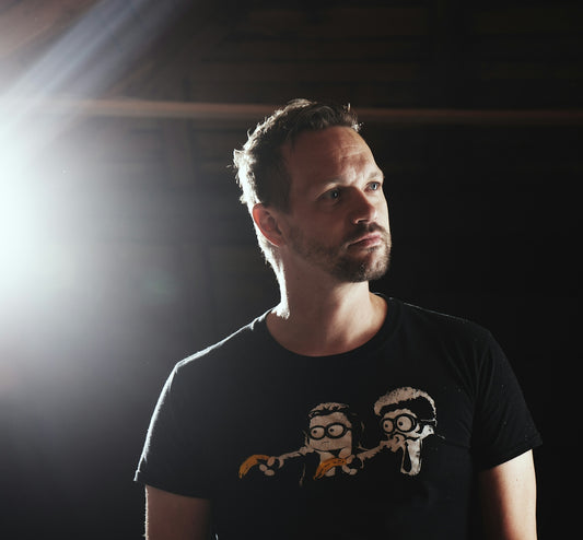 Man with beard wearing a graphic t-shirt