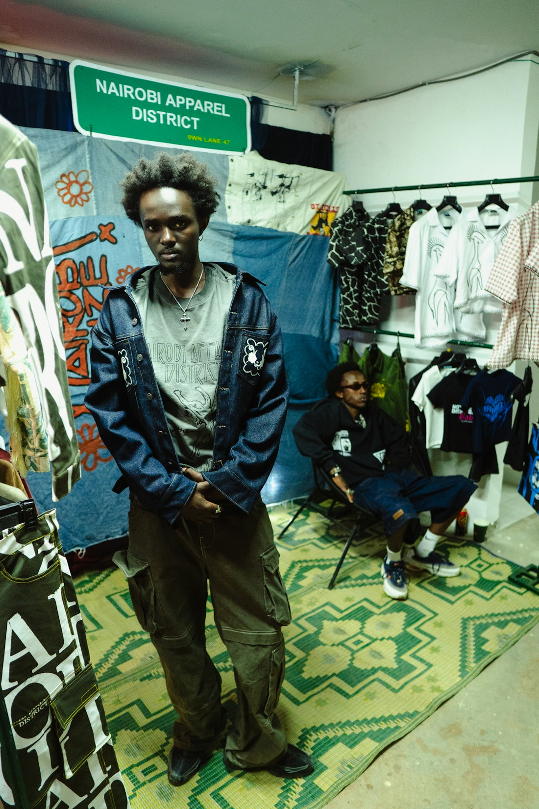 Two men in a nairobi apparel district store.