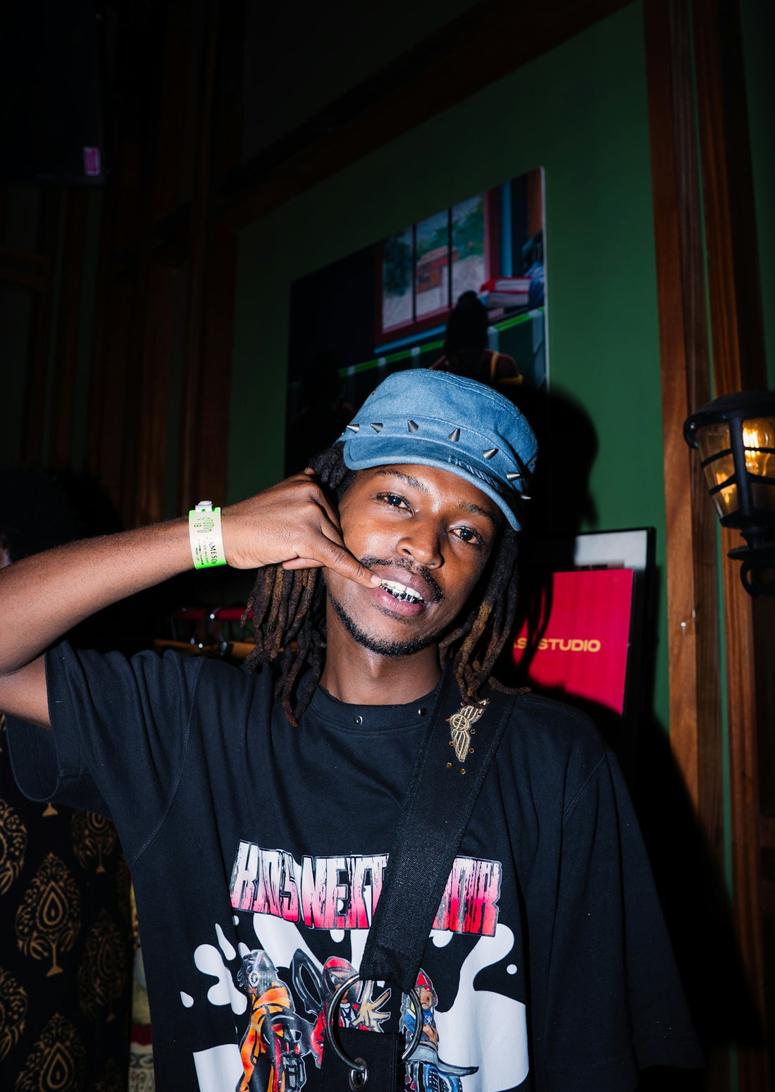 Young man wearing a blue cap and black t-shirt