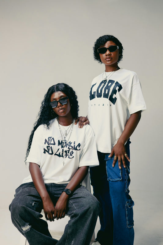 Two young women posing in casual streetwear outfits.